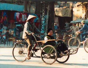A fat woman in a rickshaw in Hanoi, 1989